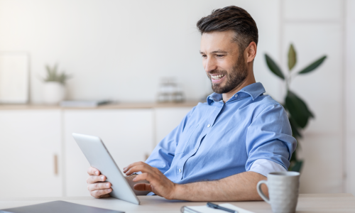 Man looking at tablet.