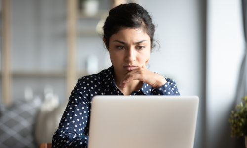 Person looking at laptop.