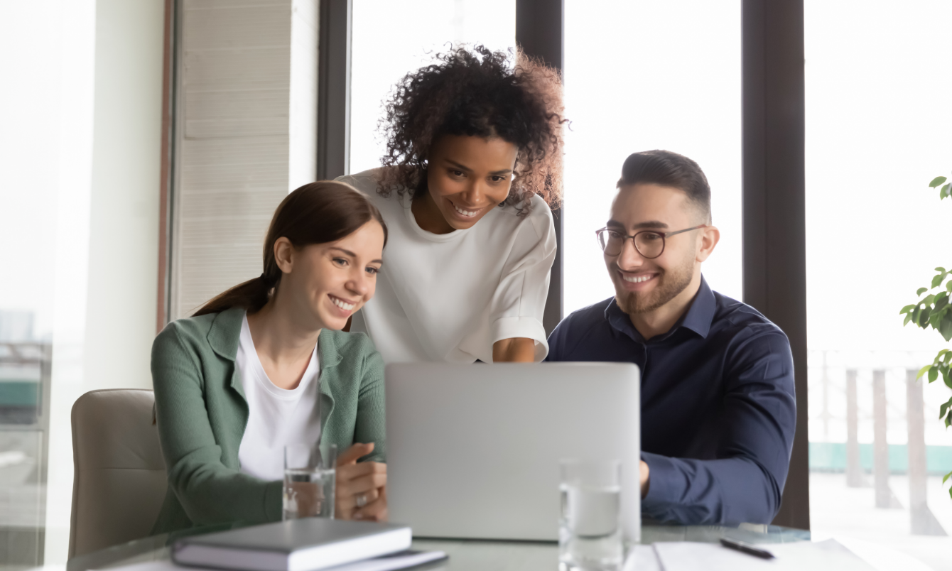 Group of people looking at laptop