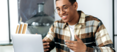 Man talking to laptop