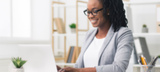 Person at desk giving a webinar presentation.
