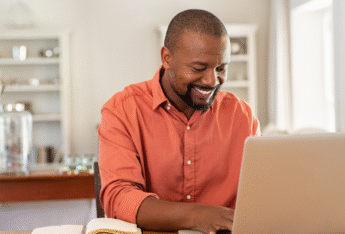 Man looking at laptop.