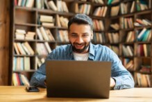 man looking at computer