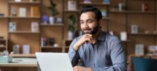 Man Thinking on laptop