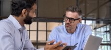 2 men discussing work