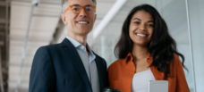 two workers smiling