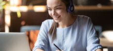 LIFESTYLE_Laptop-Headphones-Woman-Taking-Notes_500x300