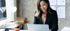 Woman looking at work laptop